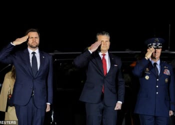 JD Vance (pictured left) oversaw the dignified transfer of the seventh US service member to die in the Iran war after Donald Trump admitted his vice president is 'less enthusiastic' about the conflict