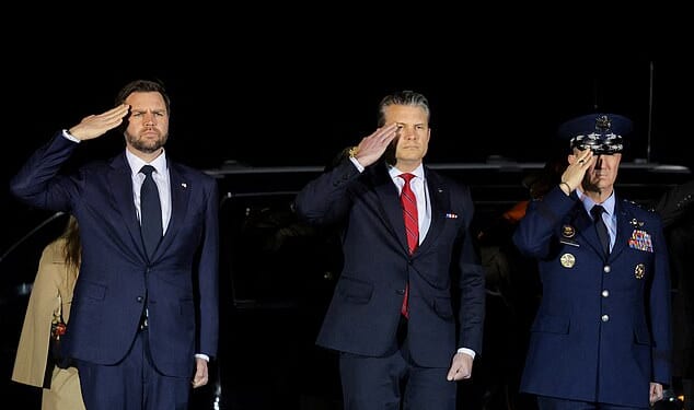 JD Vance (pictured left) oversaw the dignified transfer of the seventh US service member to die in the Iran war after Donald Trump admitted his vice president is 'less enthusiastic' about the conflict