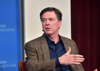 Former FBI Director James Comey speaks at Harvard Kennedy School with Harvard's Eric Rosenbach on Feb. 24, 2020, in Boston, Massachusetts.
