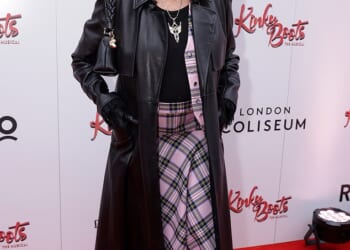 Joan Collins looked incredible in pink tartan as she stepped out to watch the gala performance of Kinky Boots at the London Coliseum on Sunday