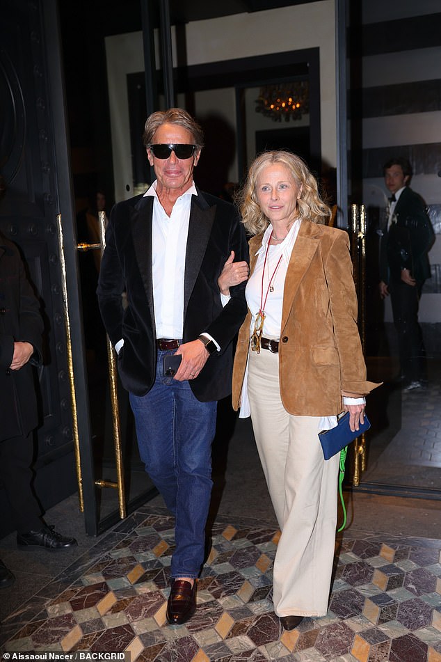 Lloyd could be seen linking arms with the mystery lady as he left the event