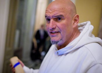 Sen. John Fetterman speaks to reporters outside the Senate Chamber on Nov. 10, 2026.