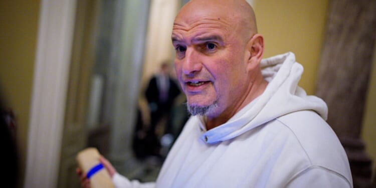 Sen. John Fetterman speaks to reporters outside the Senate Chamber on Nov. 10, 2026.