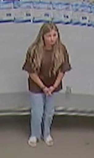 The 27-year-old wore a brown T-shirt, pale blue denim jeans and white slides