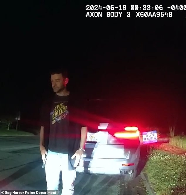 'You guys... guys,' Timberlake suddenly said while holding his hands into the air, prompting the officer to stop speaking. 'I'm just following my friends back to my house'