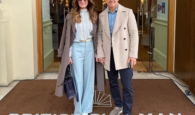 Karren Brady, 56, looked stylish as she held hands with husband Paul Peschisolido while treating her parents to their 60th wedding anniversary on the British Pullman on Friday