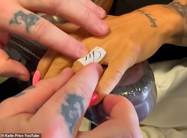 Katie has made it clear she doesn't care what anyone thinks of the businessman and last week got 'Lee' inked on her finger