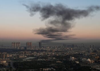 A plume of smoke rises Sunday near Erbil International Airport in Erbil, Iraq. Loud explosions were heard early on March 1 near Erbil airport, which hosts U.S.-led coalition troops in Iraq's autonomous Kurdistan region, an AFP journalist said. On Wednesday, reports circulated that Iraqi Kurds are initiating a ground offensive against Iran.