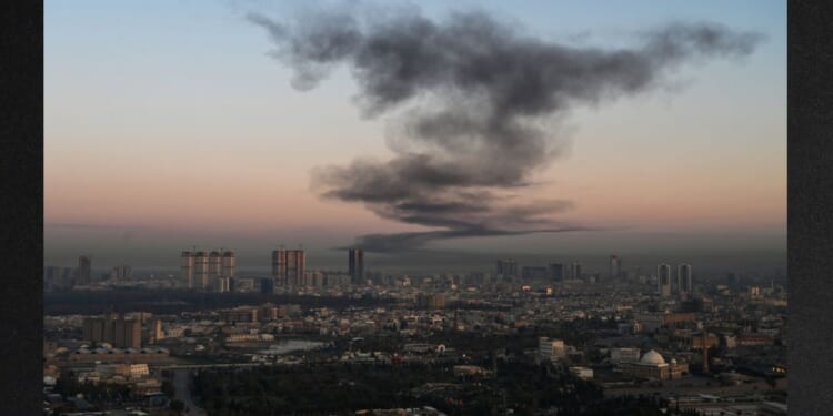 A plume of smoke rises Sunday near Erbil International Airport in Erbil, Iraq. Loud explosions were heard early on March 1 near Erbil airport, which hosts U.S.-led coalition troops in Iraq's autonomous Kurdistan region, an AFP journalist said. On Wednesday, reports circulated that Iraqi Kurds are initiating a ground offensive against Iran.