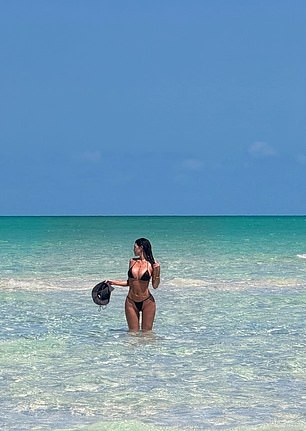 Jenner was knee-deep in the clear ocean water as she soaked up the sun