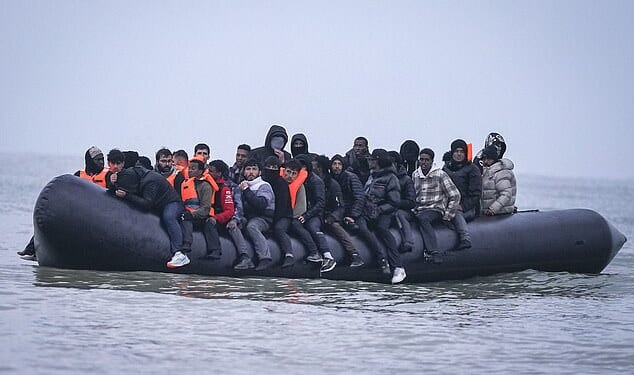 A 'taxi boat' collects migrants from Gravelines beach on the French coast as they start an illegal crossing to the UK