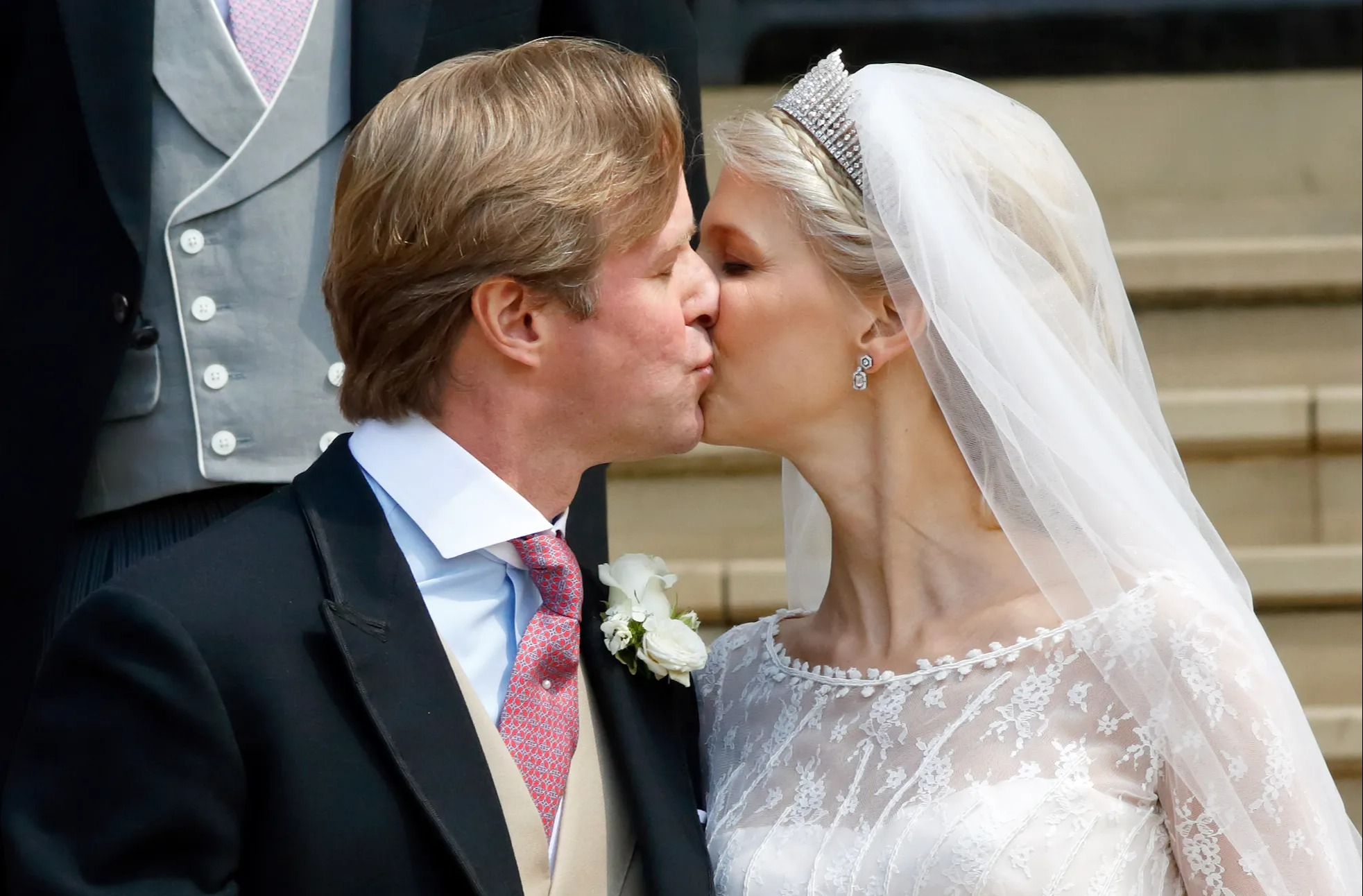 Thomas Kingston and Lady Gabriella Windsor share a kiss after their wedding at St George's Chapel.