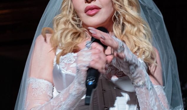 Madonna has modeled a bridal look complete with lace gloves and a delicate veil for the new Dolce & Gabbana campaign