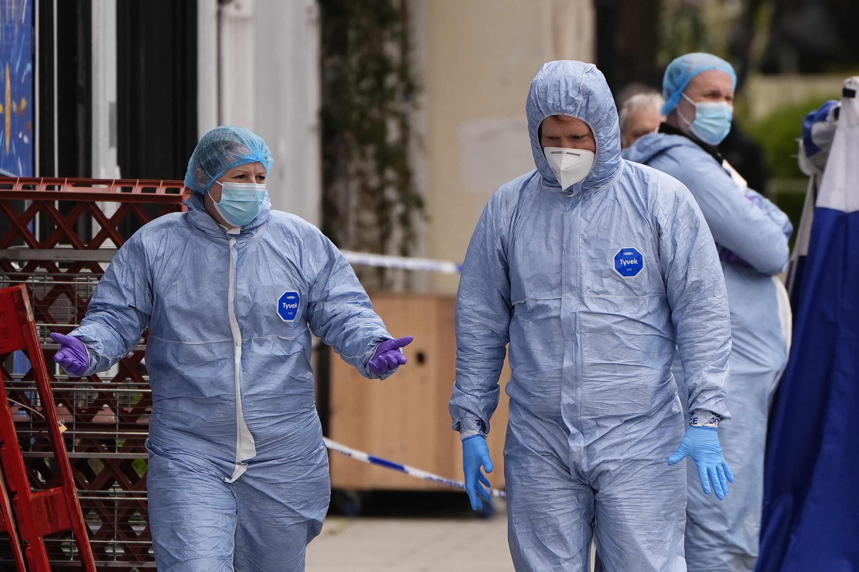 Forensic investigators at a crime scene on Chalton Street.
