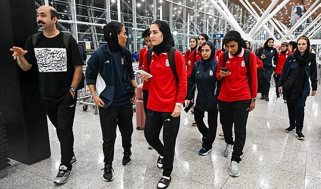 Pictured: Iranian team members arriving at Kuala Lumpur Airport on their way back to Iran, where they face possible severe reprisals for their anthem boycott