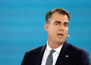 Gov. Kevin Stitt of Oklahoma speaks at the Bloomberg New Economy Forum in Singapore on Nov. 21, 2025.