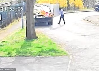 Shocking CCTV footage shows how the man, who appeared to be wearing a balaclava, pulled up at the cul-de-sac in Chingford, Essex, shortly after 11:45am on Monday