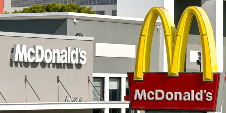 A McDonalds sign sits outside of a McDonald's branch in Miami on Dec. 3, 2023.