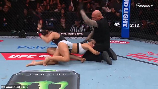 After the ref called a halt to the fight, Barber appeared to cling to his leg for help in Seattle