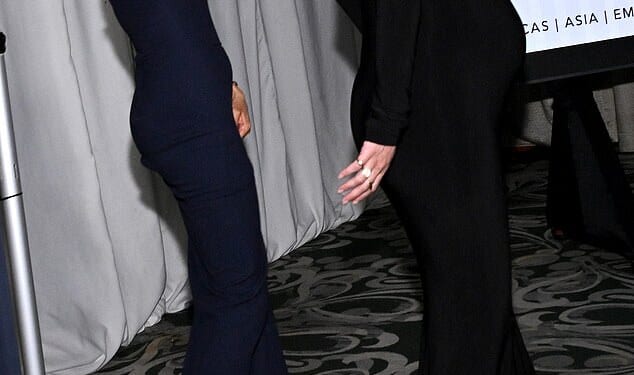 The Duchess of Sussex leaves the red carpet and waves to the photographers at a Beverly Hills chairty bash last night