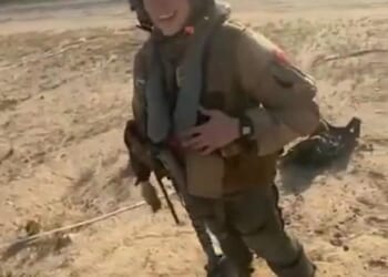 The unknown female pilot beamed ear-to-ear despite being shot out of the sky moments before in a friendly fire mishap