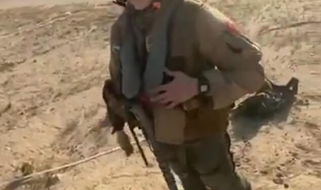 The unknown female pilot beamed ear-to-ear despite being shot out of the sky moments before in a friendly fire mishap