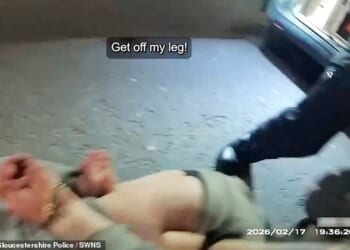 Footage shows the moment Luke Goodhall bites a police officers leg