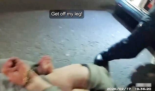 Footage shows the moment Luke Goodhall bites a police officers leg