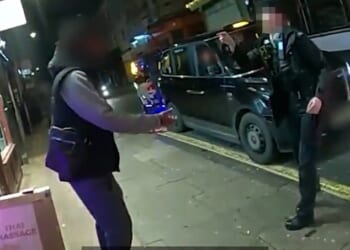 This is the moment (pictured) two brave female police officers confronted a man brandishing a knife, shoving him into a shopfront to take the blade off the streets