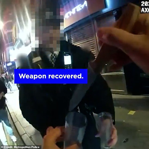 In the middle of their routine duties, they spotted the passerby carrying the weapon, right in the centre of the busy West End. Pictured: The officers seize the knife