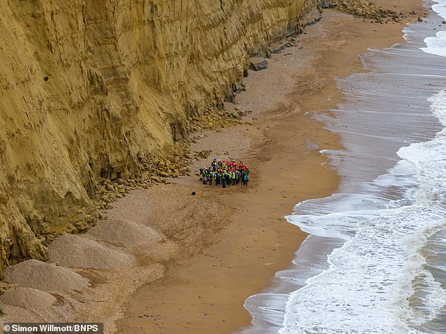 The 180-million-year-old sandstone rocks regularly fall from the cliff, prompting warnings from the council to not walk under them