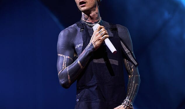 A Machine Gun Kelly fan suffered a mortifying moment after falling through a hole in the stage during the rapper's London concert on Thursday (seen above)