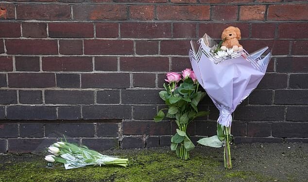 Flowers, including tulips and roses, and a soft toy animal were laid near the Peabody Estate building on Saturday