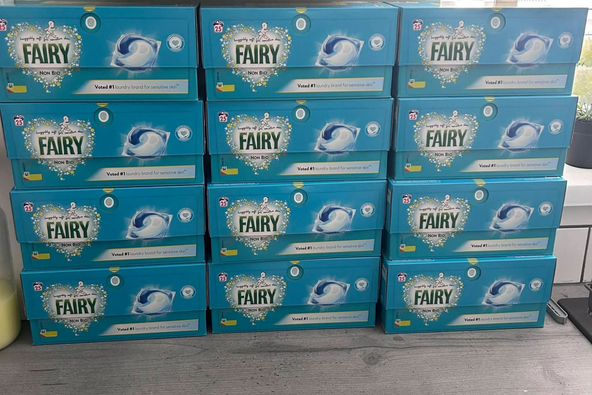 An image collage containing 1 images, Image 1 shows A large haul of 12 boxes of Fairy Non Bio laundry pods and a Tesco receipt