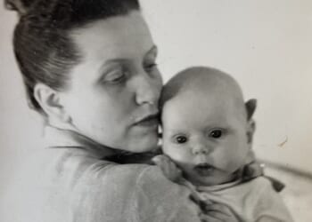 Beatrice holds a newborn Alexandra - decades later, the child became the carer