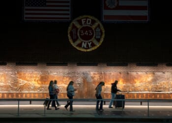 People walk by a Ground Zero memorial to the FDNY's lost members from 9/11 on Sept. 9, 2025, in New York City.