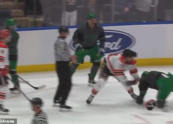 Police officers and firemen rained down punches on each other at UBS Arena in New York
