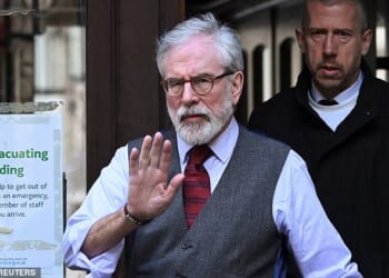 Security chief: Gerry Adams (left) at the Royal Courts of Justice in London on March 11 with John Trainor (right)
