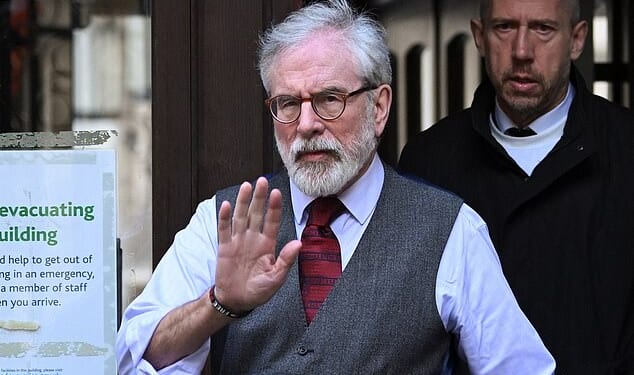 Security chief: Gerry Adams (left) at the Royal Courts of Justice in London on March 11 with John Trainor (right)