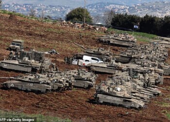 Israel has sent troops into the south of Lebanon as it seeks to destroy Hezbollah. (Pictured: Israeli tanks massing at its northern border with Lebanon)