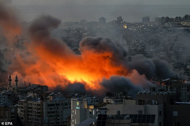 Smoke and flames rise following an Israeli airstrike on Dahieh, a Hezbollah stronghold in the south of Beirut