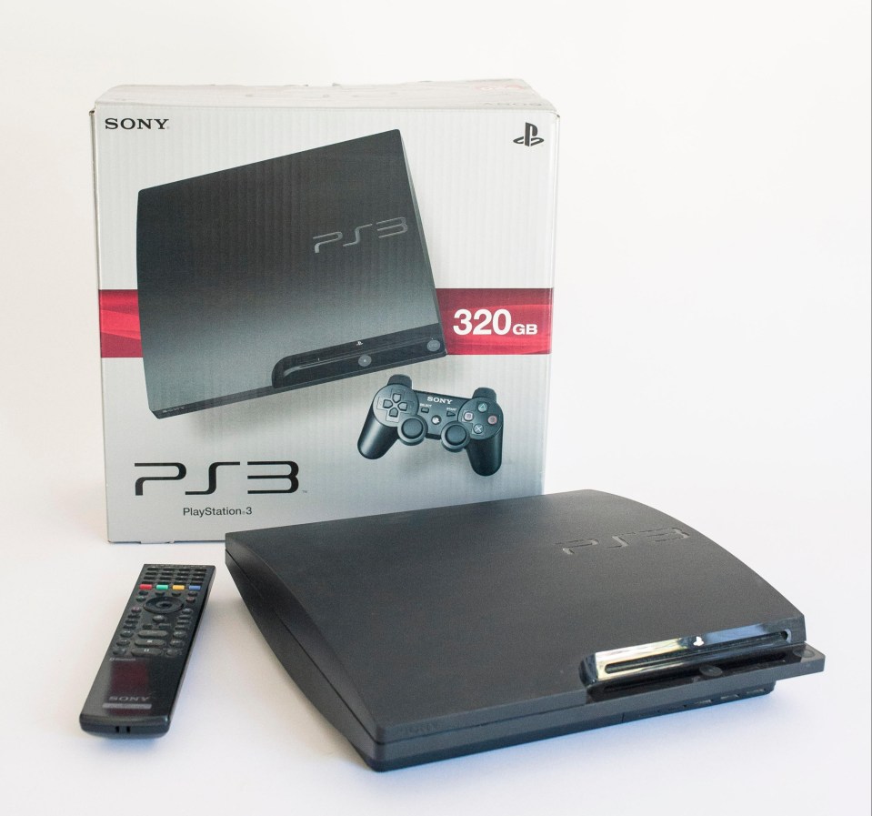 Sony PS3 gaming console, remote, and console box.