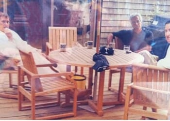 The picture, which shows the disgraced ex-prince and former US ambassador in bathrobes, while Epstein is fully clothed, is believed to have been taken outside at Martha's Vineyard in Massachusetts