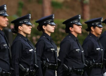 Los Angeles Police Department officer recruits from class 8-25 stand at attention during their graduation ceremony at the Los Angeles Police Academy in Los Angeles, California, on Feb. 6, 2026.