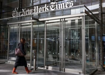 A person enters The New York Times building in New York City in a file photo dated Jan. 22 .