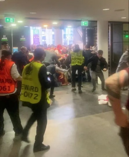 Video grab shows fans attempting to get through a door meant for disabled access at Wembley Stadium.