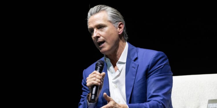 California Gov. Gavin Newsom sits at an event promoting his book "Young Man in a Hurry" on Feb. 28, 2026, in San Francisco, California.