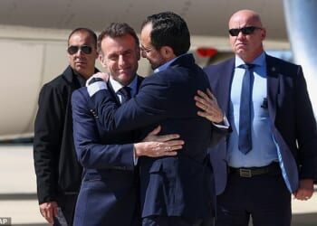 Greeting: Mr Macron and Cypriot leader Nikos Christodoulides in a a display of diplomatic power