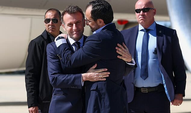 Greeting: Mr Macron and Cypriot leader Nikos Christodoulides in a a display of diplomatic power