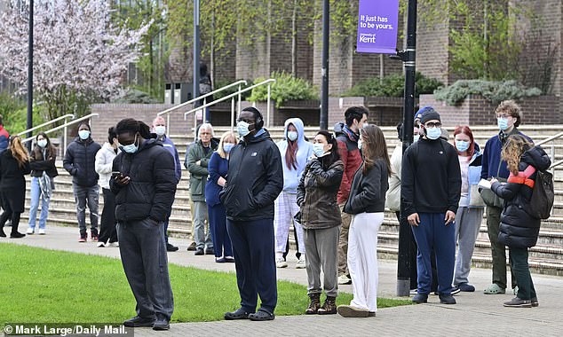 Students queue for antibiotics outside the University of Kent in Canterbury yesterday